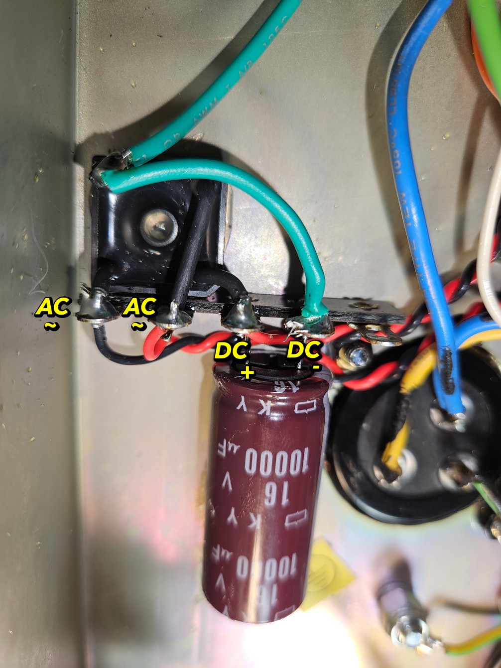 Wiring detail showing AC and DC connections to a capacitor
